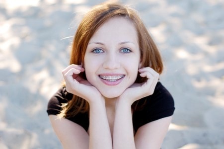 smiling teen with braces